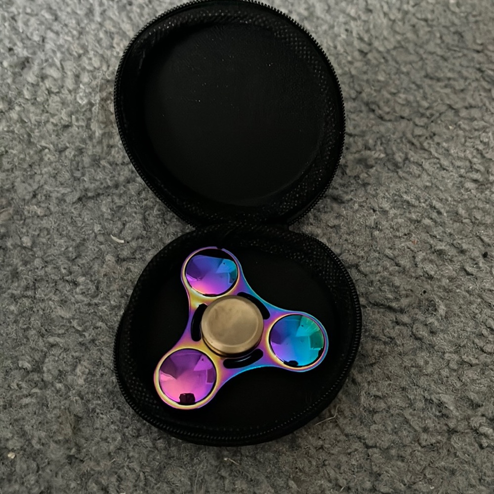 Fidget spinner, with additional case.